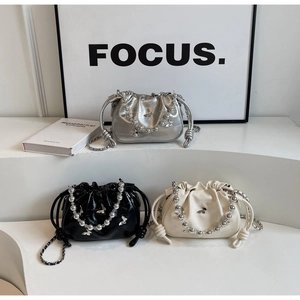 Three pleated cloud bags with beaded chains and butterfly charms in silver black and cream