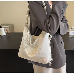Detail of New Chinese style embroidered tote bag with phoenix patterns and tassel charm
