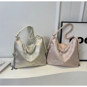 Detail of Chinese style jacquard hobo bags with floral embroidery and chain straps