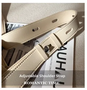 Close-up of adjustable beige leather strap with silver buckle and fine stitching
