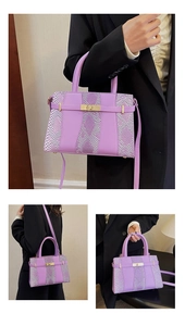Detail of purple crossbody bag featuring faux snakeskin texture and golden turn-lock