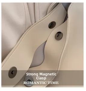Detail shot of the powerful magnetic snap closure on a cream large-capacity tote bag