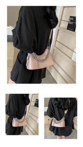 Pink crescent moon underarm bag with silver chain detail shown from multiple side angles