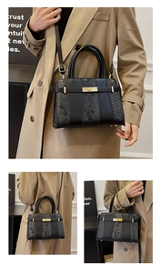 Detailed views of a black faux snakeskin Kelly bag with gold lock on a trench coat model