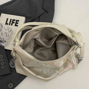 Champagne floral jacquard tote bag with spacious interior and gold chain detail