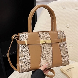 Caramel brown handbag with snake pattern texture and gold hardware for women