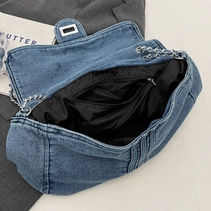 Retro denim blue shoulder bag with silver chain strap and large interior compartment