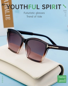 Detailed close-up of polarized cat-eye sunglasses with golden T-shape metal accents