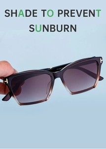 Detail of polarized cat-eye sunglasses with gold T-shaped metal hinge and brown gradient