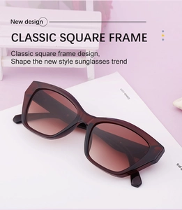 Detailed macro view of classic square sunglasses in reddish-brown frame with gradient lenses