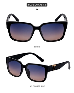 Detail of square oversized sunglasses with blue-orange gradient lenses and golden T-hinge