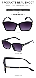 Polarized cat eye sunglasses with bright black frames and gold T-hinge detail