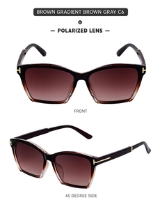Detail view of large cat-eye polarized sunglasses featuring brown gradient lenses and golden T-hinges