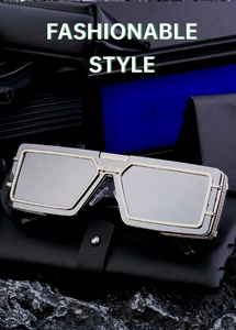 Detailed close-up of fashionable square sunglasses with metallic silver and gold frames