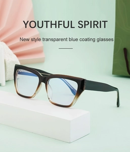 Close-up of cat-eye glasses with brown gradient frames and transparent blue coating lenses