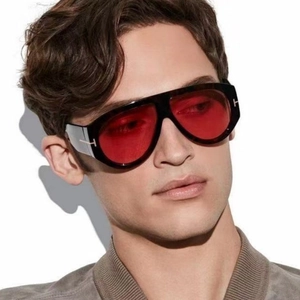 Detail of red lenses and black aviator frame with metallic T-shape temple accents