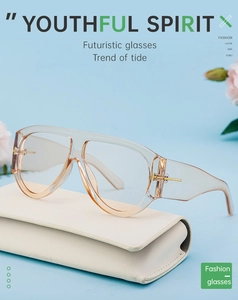 Detail of transparent champagne frames with gold metal hinges and cream leather case