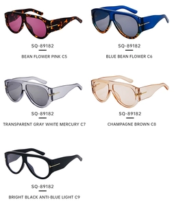 Close-up of assorted oversized aviator sunglasses with signature metal T-hinge detail
