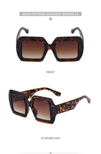 Détail de lunettes de soleil carrées oversize écaille avec verres dégradés marron