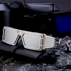 Futuristic steampunk sunglasses with black rectangular frames and gold metal side shields