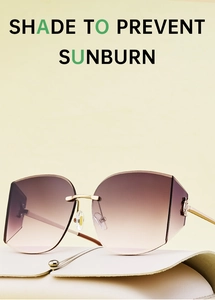 Detail of rimless gradient lenses and gold metal temples with luxury leather case