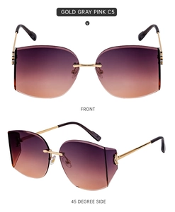 Macro detail of rimless gradient sunglasses with gold metal frame and black temple tips