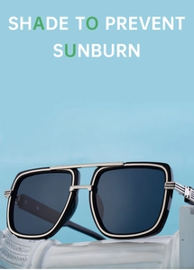 Détail de la charnière en métal argenté sur les lunettes de soleil carrées noires