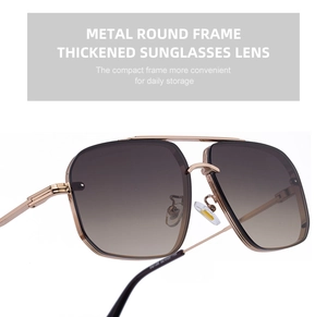 Nahaufnahme der goldenen runden Metall-Aviator-Brille mit braunen Verlaufsgläsern