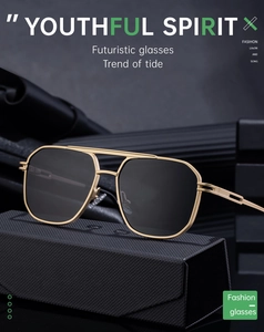 Detail of pilot sunglasses with gold double-bridge frame resting on a premium black case