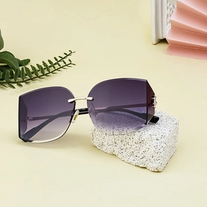 Frameless oversized sunglasses with purple gradient lenses and gold hollow metal temples