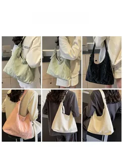 Detailed views of multi-color pleated underarm bags with spacious interiors and glossy finish