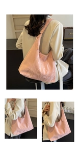 Detail of pink glossy pleated shoulder bag showing the unique crinkled texture and strap