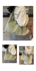 Detail of light green pleated hobo bag showing large capacity and textured surface