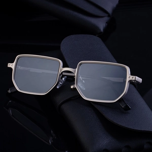 Modern square metal sunglasses with geometric champagne gold frame and dark lenses