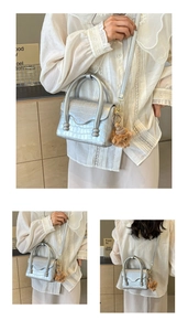 Detailed silver crocodile pattern crossbody bag with a cute bear plush pendant accessory