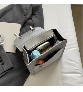 Interior view showing the large capacity of the silver PU leather crossbody bag