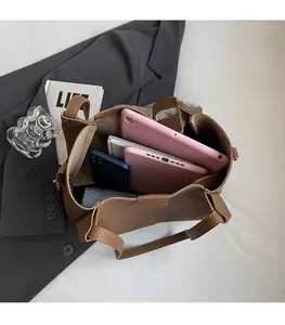 Brown litchi leather tote bag interior showing large capacity for tablet and umbrella