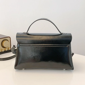 Classic black glossy underarm bag with silver hardware and retro minimalist shoulder strap