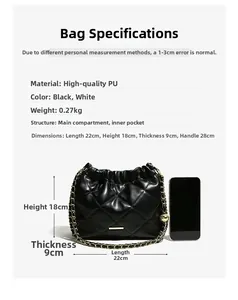 Detailed view of black quilted bucket bag with gold chain strap and size reference