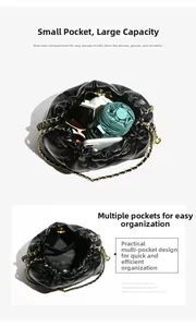 Detail view of quilted bucket bag interior with dual main compartments and gold chain