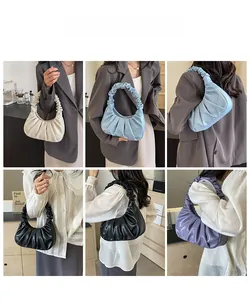 Detail of ruched cloud underarm bags in white, blue, black and purple leather