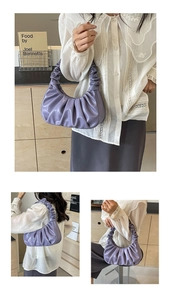 Detailed close-up of light purple pleated cloud bag showing the soft texture and texture