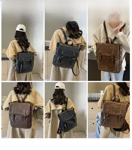 Detailansicht großer Vintage-Lederrucksäcke in den Farben Schwarz und Braun