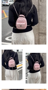 Detailed views of a mini pink quilted backpack with silver chain straps and turn-lock pocket