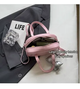 Interior view of pink shell bag showing spacious capacity for phone and wallet