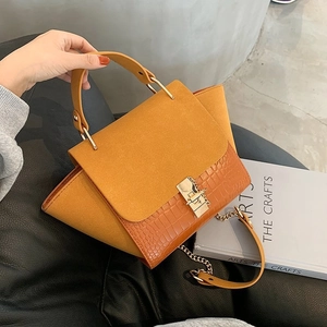 Chic yellow suede and croc-embossed wing bag with gold chain strap for women