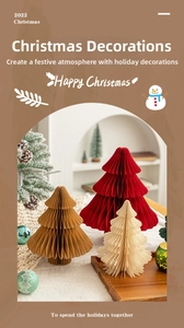 Close-up of foldable paper honeycomb Christmas trees in festive warm home setting