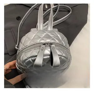 Detail of silver quilted mini backpack with metallic finish and premium hardware