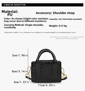 Detail view of mini black crocodile embossed bag with gold buckle and PU texture