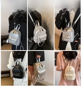Quilted mini backpack styled on model in silver, black and beige color options